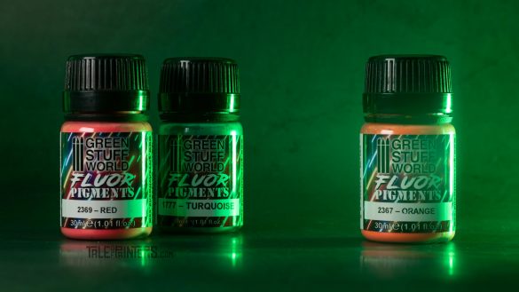 3 pots of Green Stuff World fluor pigments on green lit background