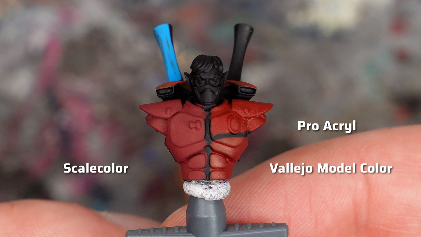 An Aeldari Guardian demo model painted with various red paints from Scalecolor, Pro Acryl, and Vallejo Model Color. The Scalecolor Deep Red has the most matte finish.