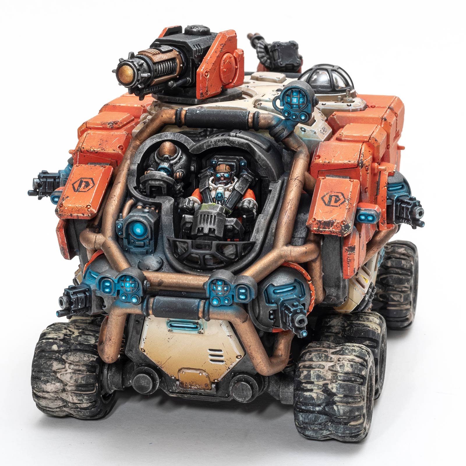 Orange painted Votann Hekaton Land Fortress with the windscreen removed, photographed on a white background