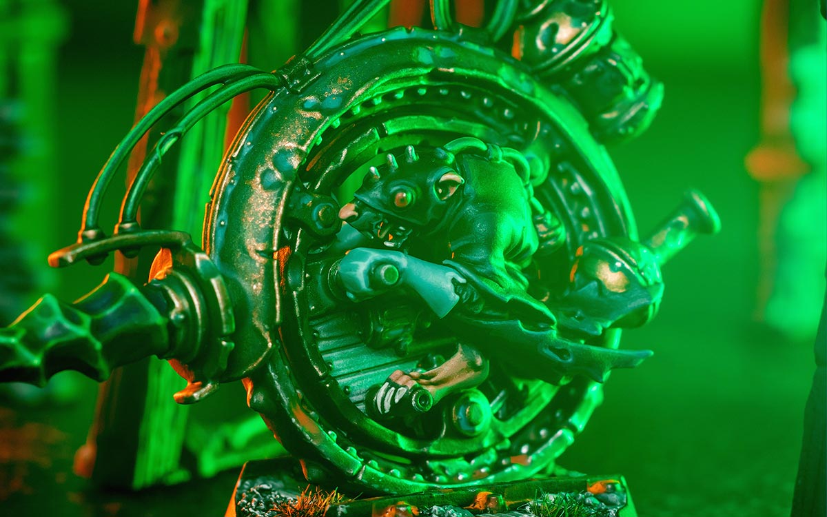 Cinematic detail shot of Rittak Verm in his Skaven Clan Skyre Killwheel, from Zikkit's Tunnelpack, lit with eerie green warplight