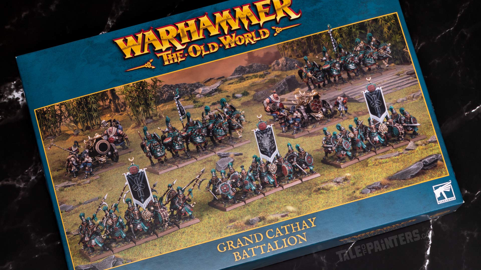 Grand Cathay Battalion box from Warhammer: The Old World, arranged on a black marble background for a review and unboxing