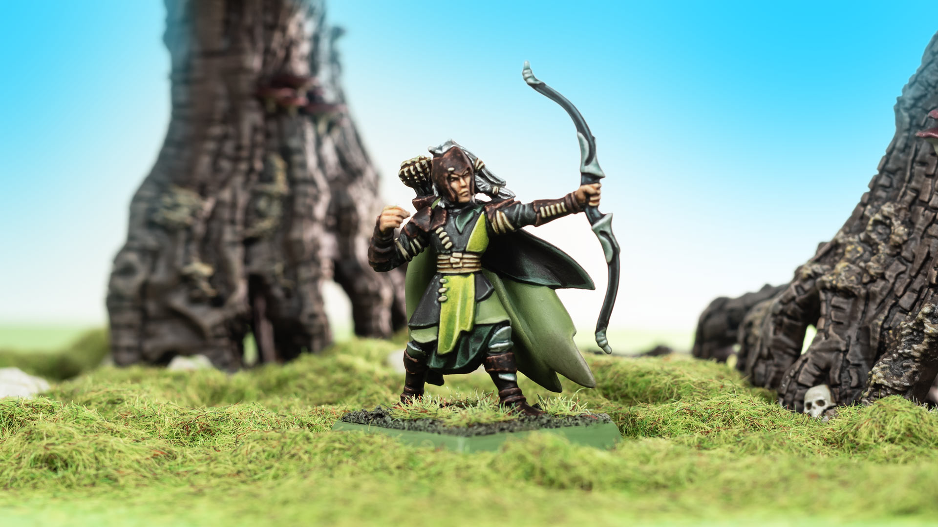 Painted Wood Elves Glade Guard model from Warhammer The Old World, standing on green flock in front of trees and a bright blue background, painted by Stahly