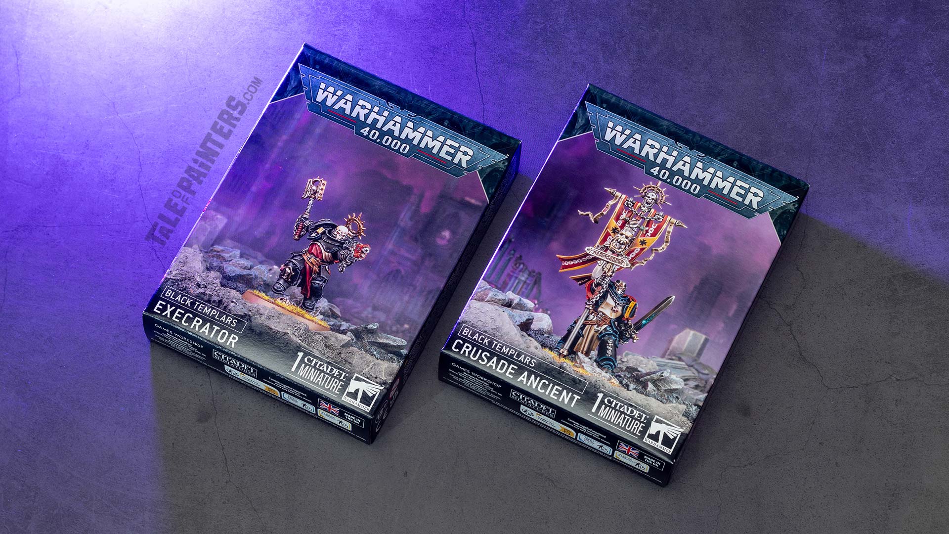 Black Templars Execrator and Crusade Ancient product boxes arranged on a concrete background lit with purple light, photographed for review purposes