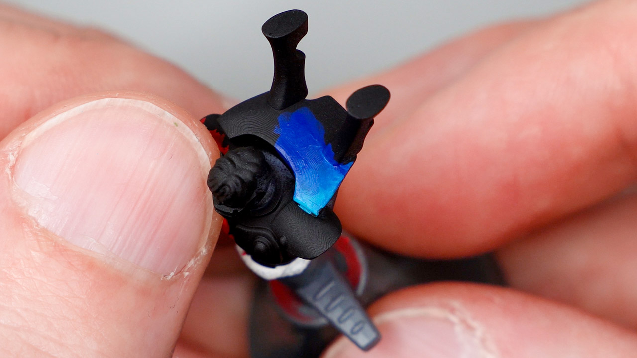A black primed Aeldari Guardian with blue and turquoise colours from the P3 hobby paint range blended together