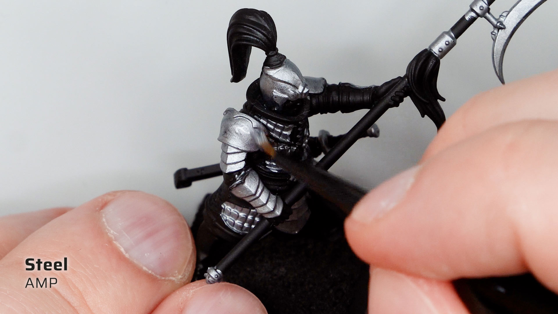 Close up shot of painting a black primed Cathay Jade Warrior with Steel from the AMP Colors range