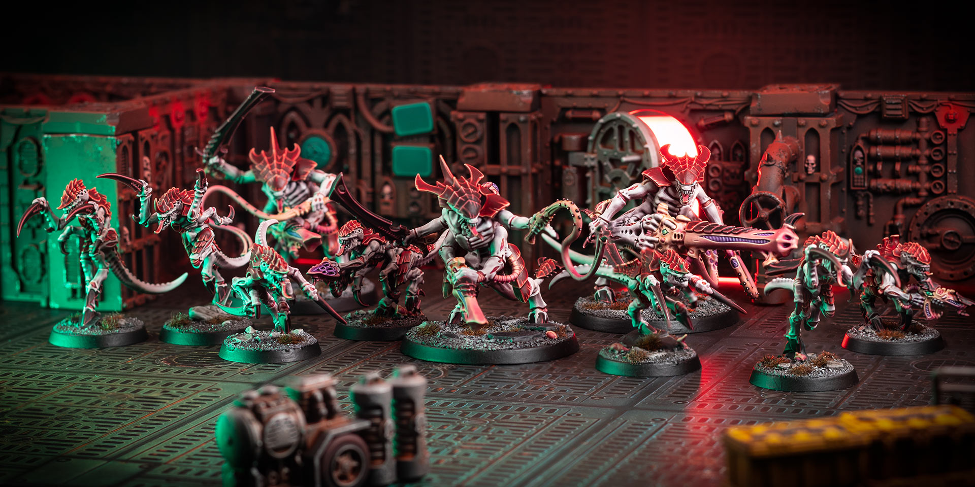 Cinematic shot of a Hive Fleet Kraken Kill Team, painted in the bone and red of Hive Fleet Kraken, in a Gallowdark Space Hulk environment lit with red and green light