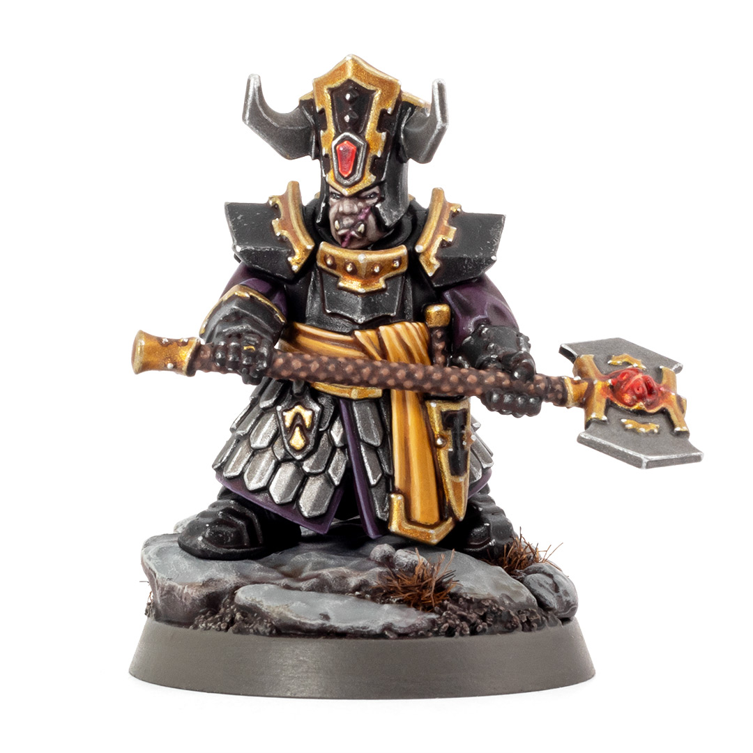 Helsmiths of Hashut Infernal Cohort Championess painted in the black, yellow, and gold of Muspelzhaar by Stahly, on a white background