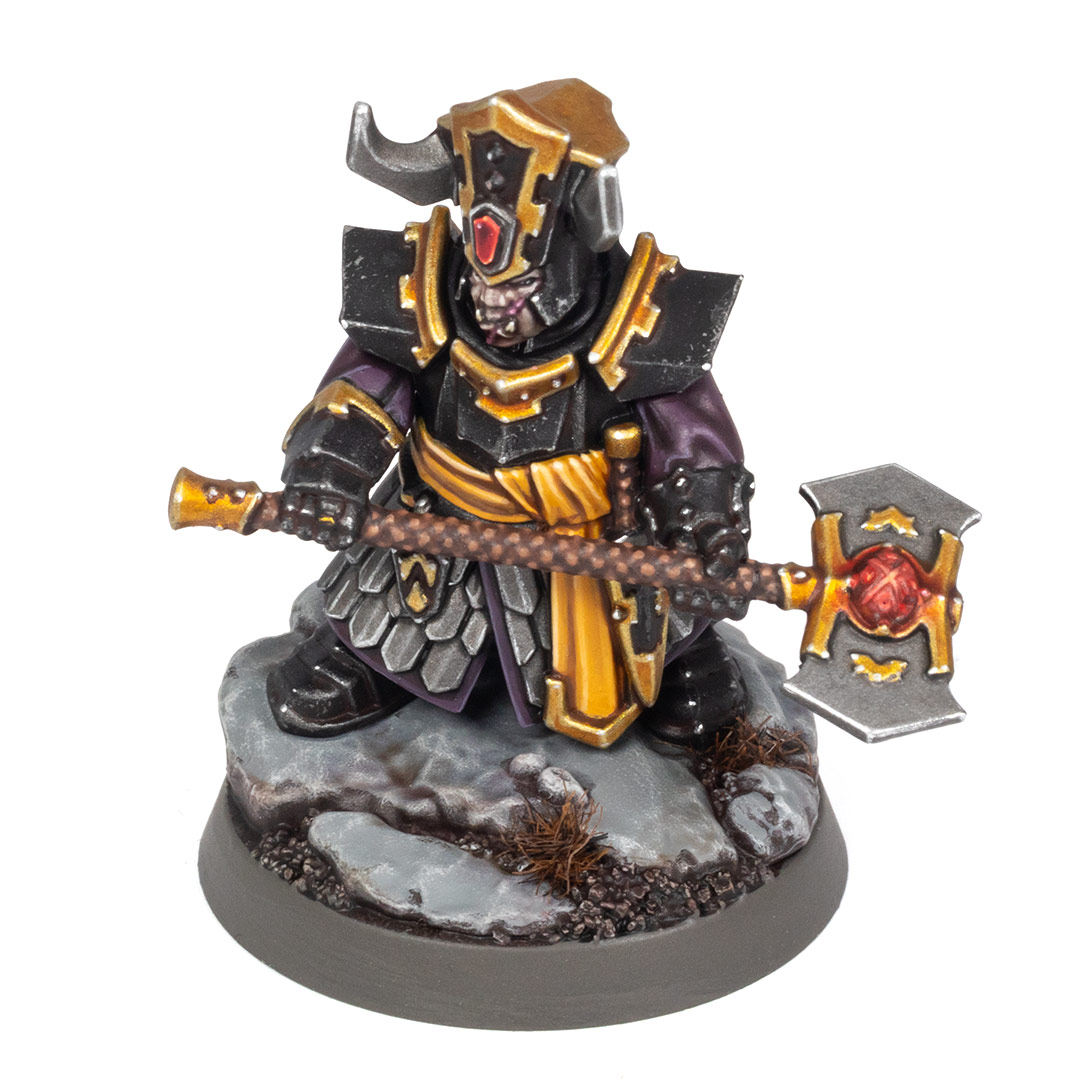 Top angle view of a Helsmiths of Hashut Infernal Cohort Championess painted in the black, yellow, and gold of Muspelzhaar by Stahly, on a white background