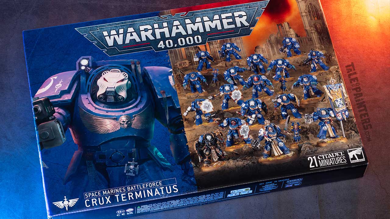 Space Marines Battleforce: Crux Terminatus box arranged on a concrete background, lit with orange and blue light, photographed for review purposes