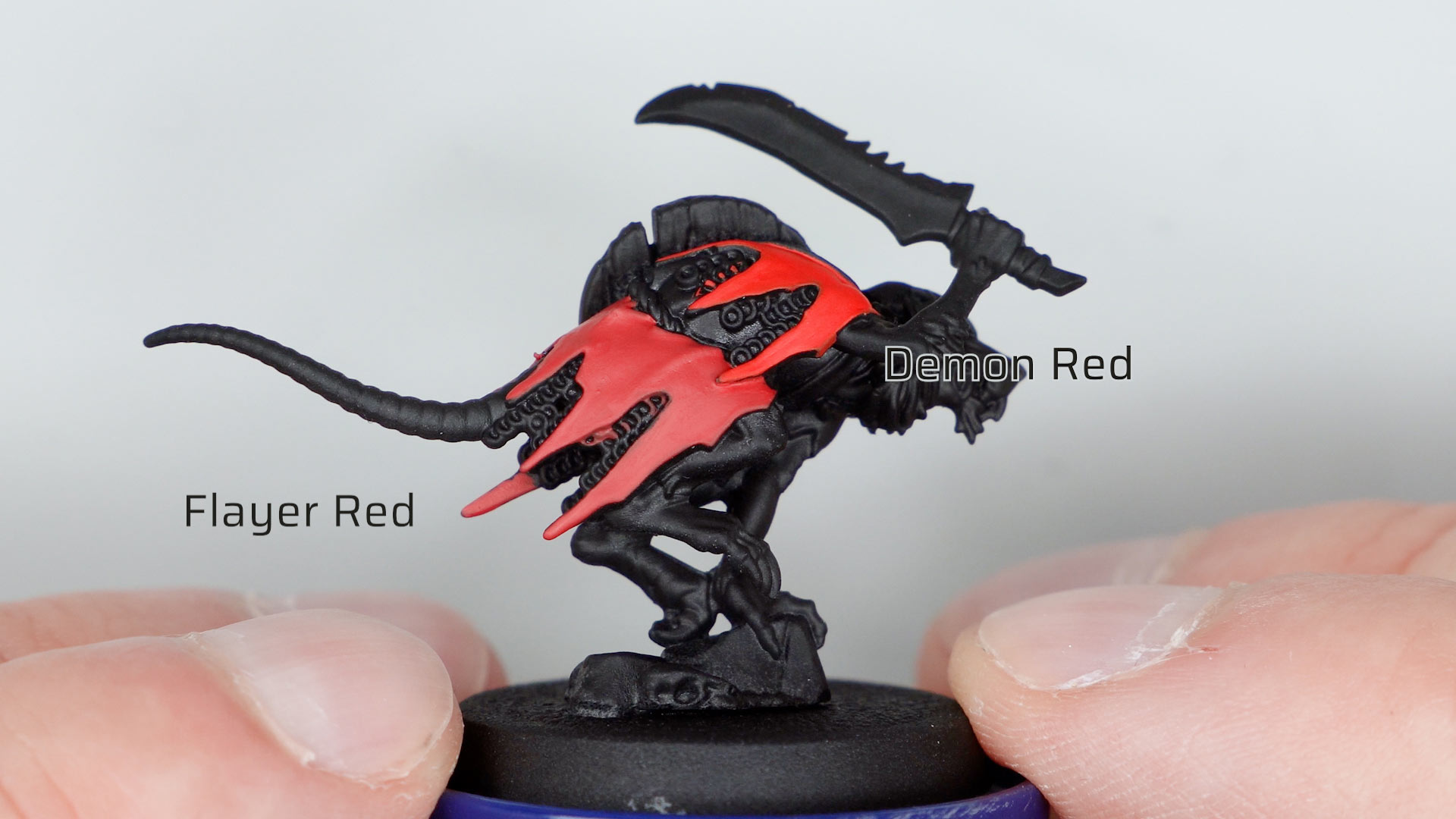 Skaven Clanrate primed black, partially painted with Dark Arts Flayer Red and Two Thin Coats Demon Red for comparison sakes