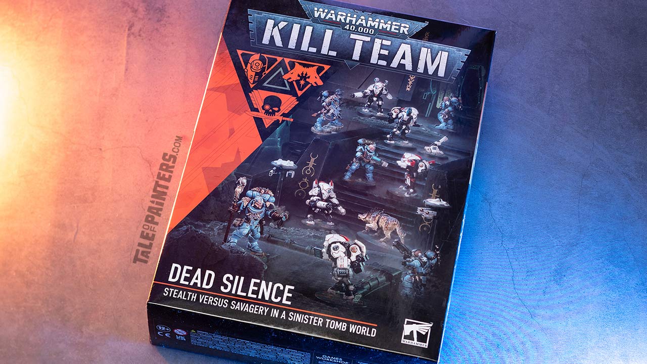 Kill Team: Dead Silence box arranged on a concrete background, lit with orange and blue light, photographed for a review and unboxing
