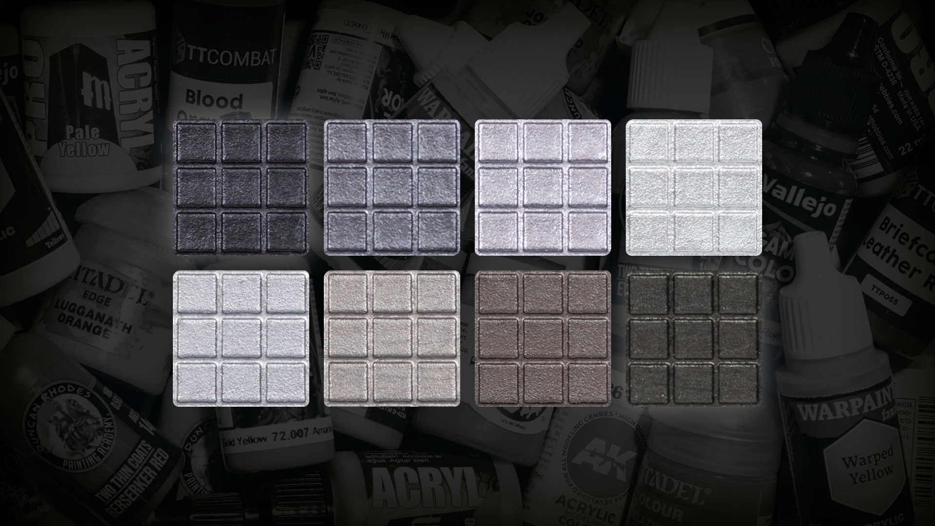 8 silver and steel paint sample squares from light to dark on a dark background, Stahly's best paint picks for warm and cold silver metallic miniature paints