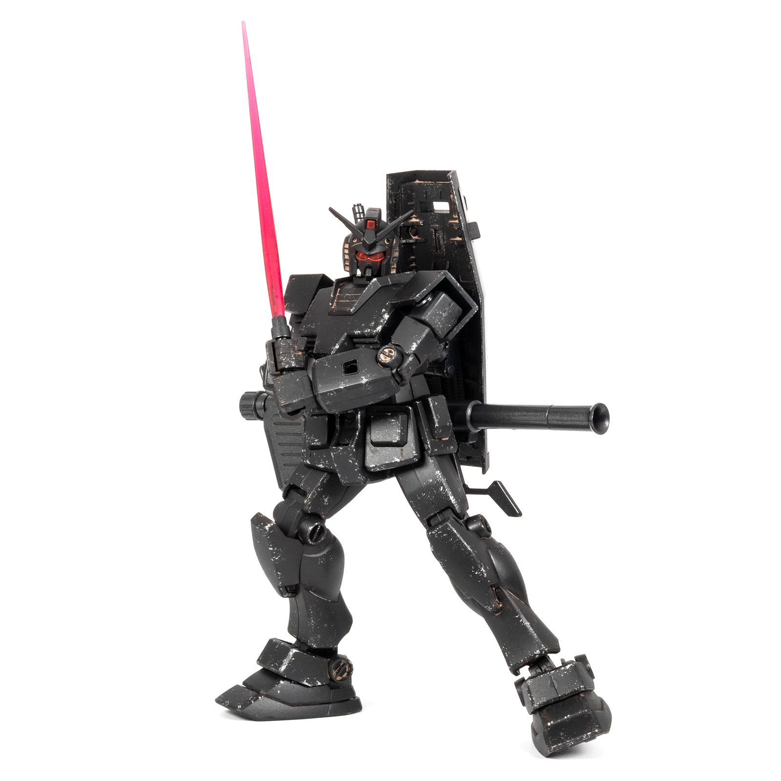 A fully black RX-78-2 Gundam HG Ecopla model, in an attack pose raising its beam saber, on a white background