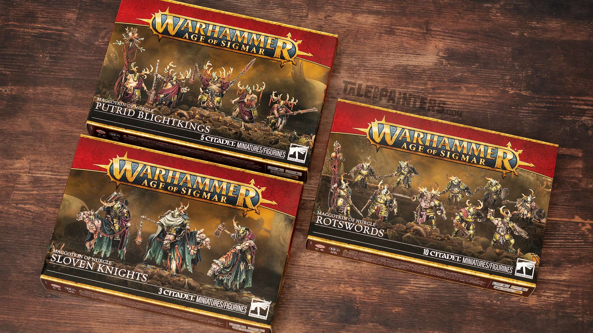 Maggotkin of Nurgle Putrid Blightkings, Sloven Knights, and Rotsword model boxes arranged on a wooden background for review purposes