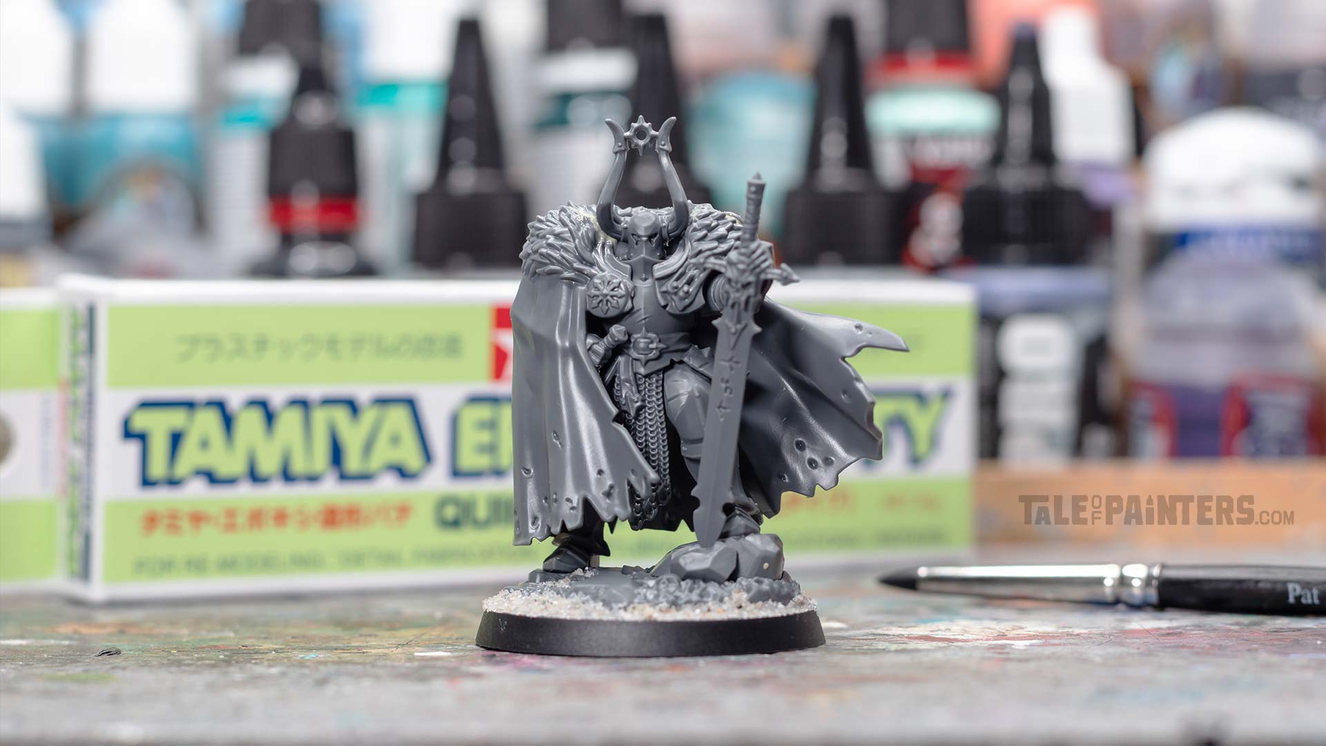 Urkhan the Dark Warden plastic model in front of a Tamiya Epoxy Putty Quick type box and clay shaper tool