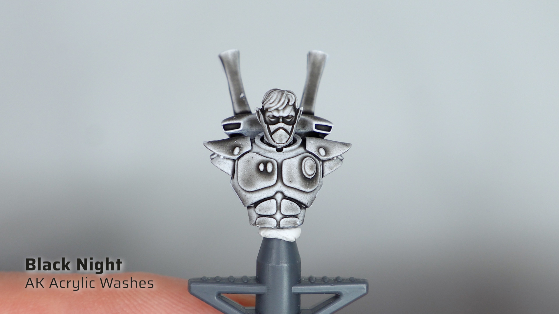 AK Black Night acrylic wash applied over a white primed Aeldari Guardian test model
