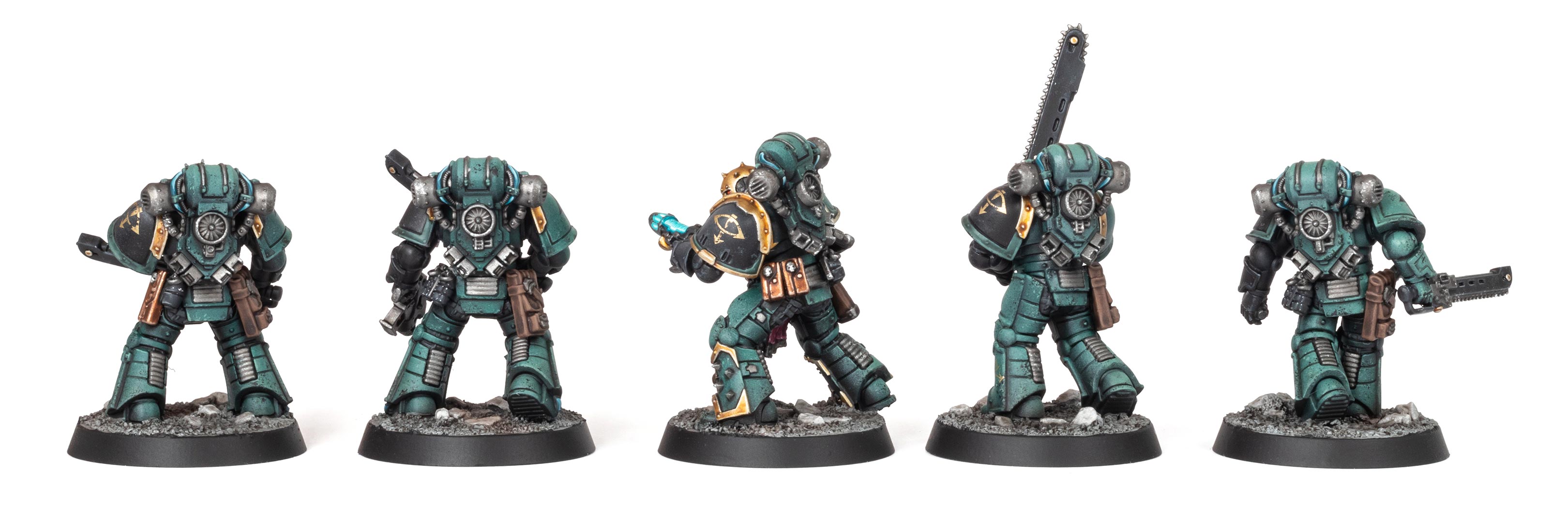 Back view of five Sons of Horus Despoiler models with various melee weapons inc. a Sergeant in artificer armour, painted by Stahly, in front of a clean white background