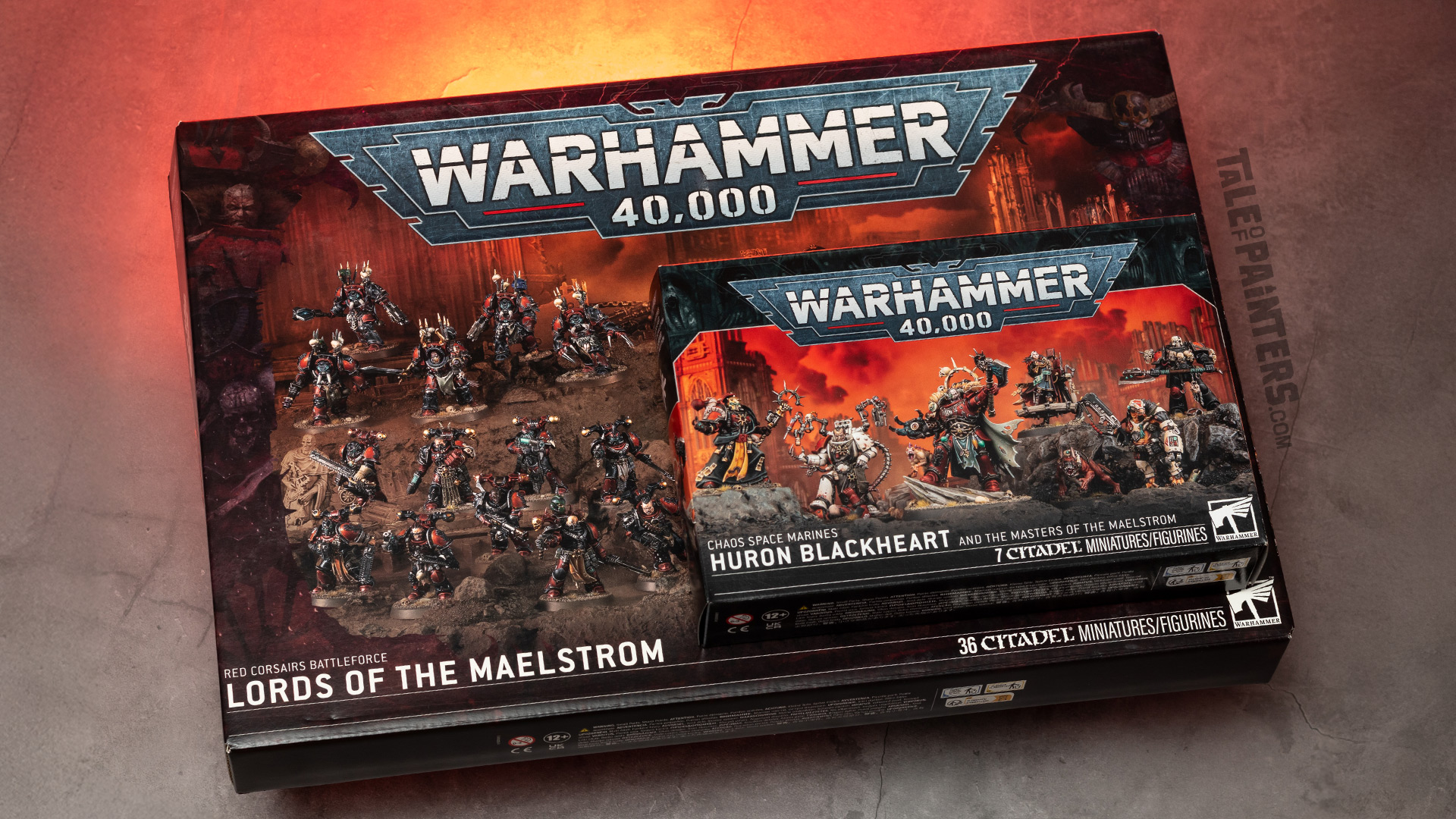 40k Red Corsairs Lords of the Maelstrom & Huron Blackheart and the Masters of the Maelstrom model kit boxes arranged on a concrete background, lit with red light