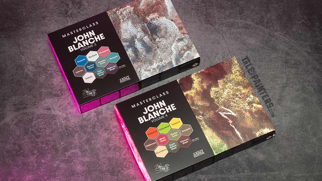 John Blanche Masterclass paint sets Vol. 3 and 4 from The Army Painter, arranged on a concrete background lit with pinkt light, taken for review purposes