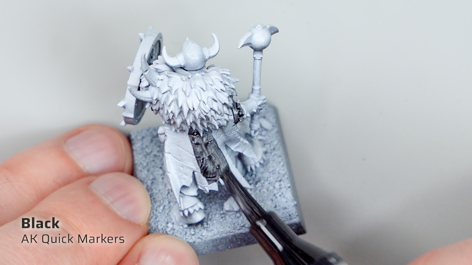 Close-up of applying black paint with AK Quick Markers on a zenithal primed Chaos Marauder model
