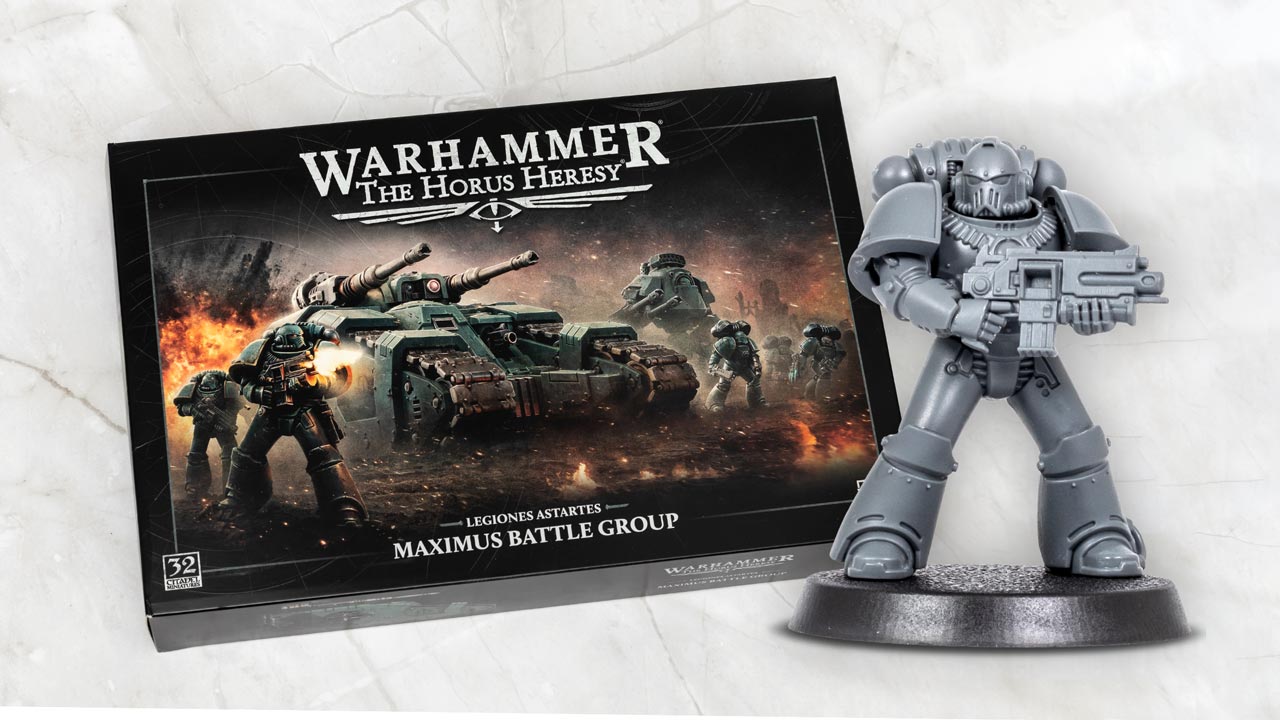 Legiones Astartes Maximus Battlegroup box for the Warhammer Horus Heresy game, arranged on a white marble background with an assembled MkIV Space Marine model