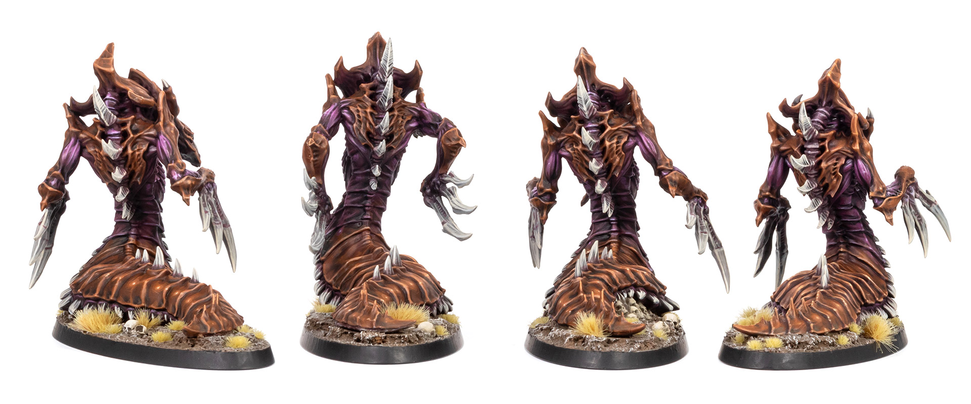 Back view of four Zerg Hydralisk models from StarCraft: Tabletop Miniatures Game, painted in a moody brown and purple paint scheme by whiskerspaints, white background