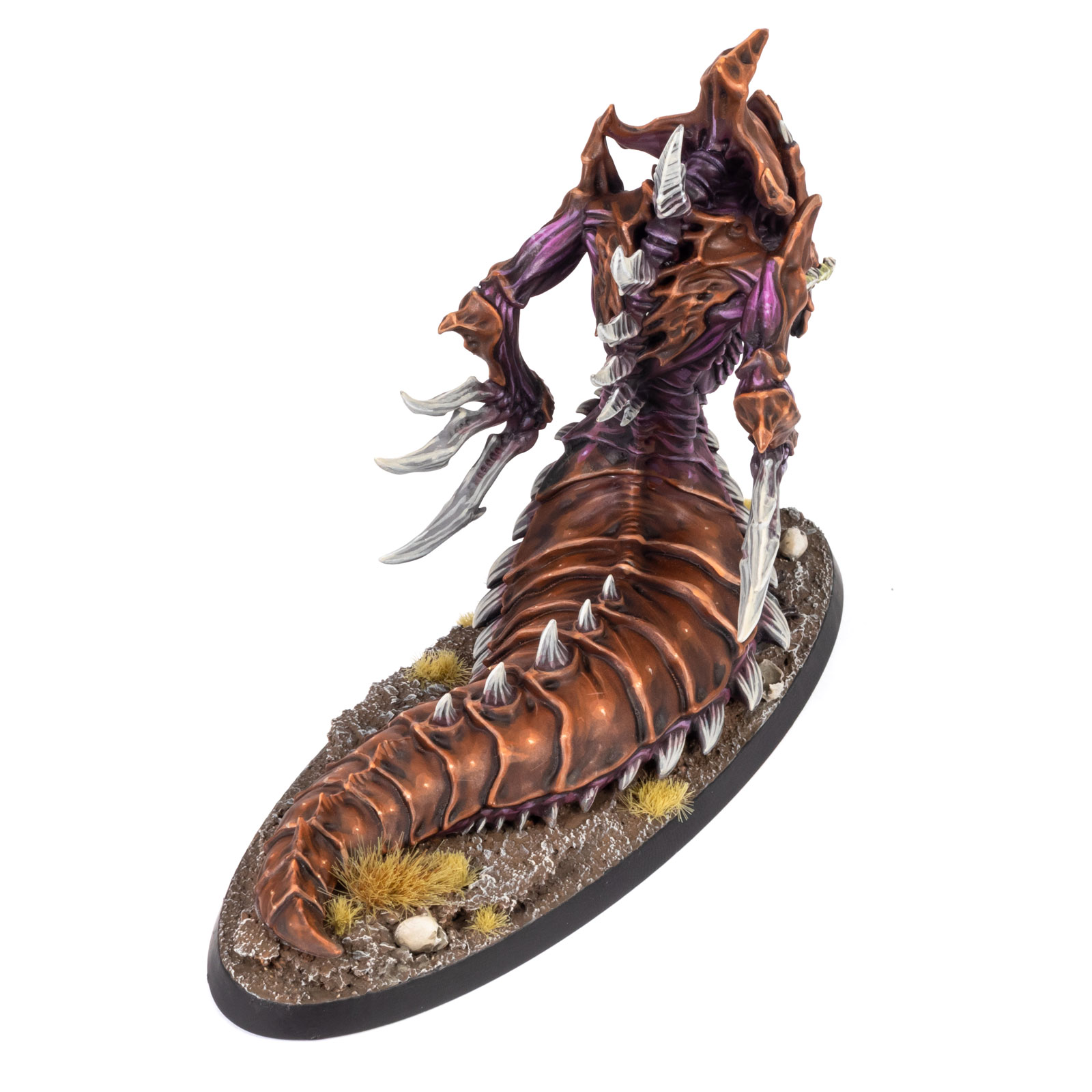 High angle back view of a Zerg Hydralisk model from StarCraft: Tabletop Miniatures Game, painted in a moody brown and purple paint scheme by whiskerspaints, white background